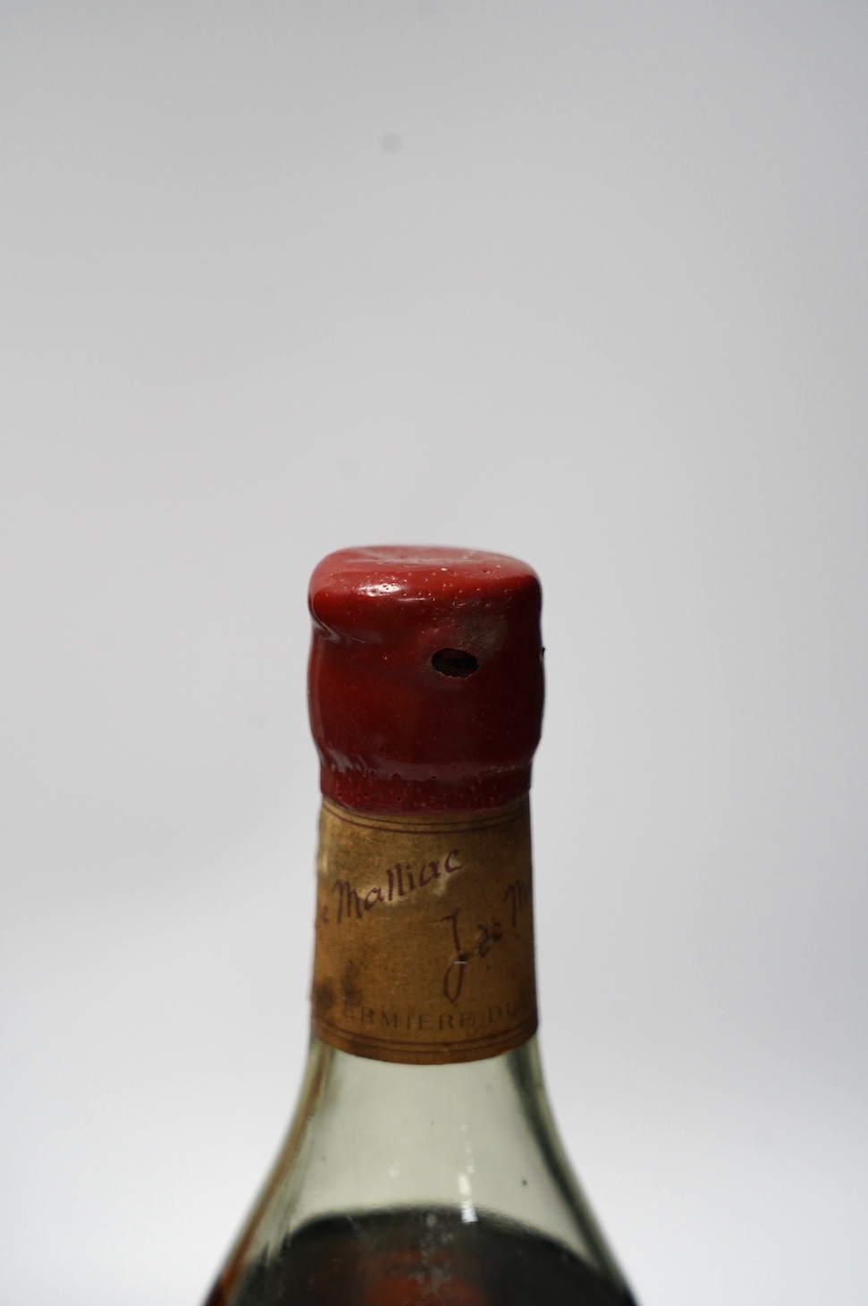 Four various bottles of alcohol to include a bottle of Taylor’s 1966 vintage port, another 1960 vintage port (label corroded), a bottle of J.de Malliac Bas Armagnac Extra Hors D’Age No.12440 and a bottle of Linie Aquavit
